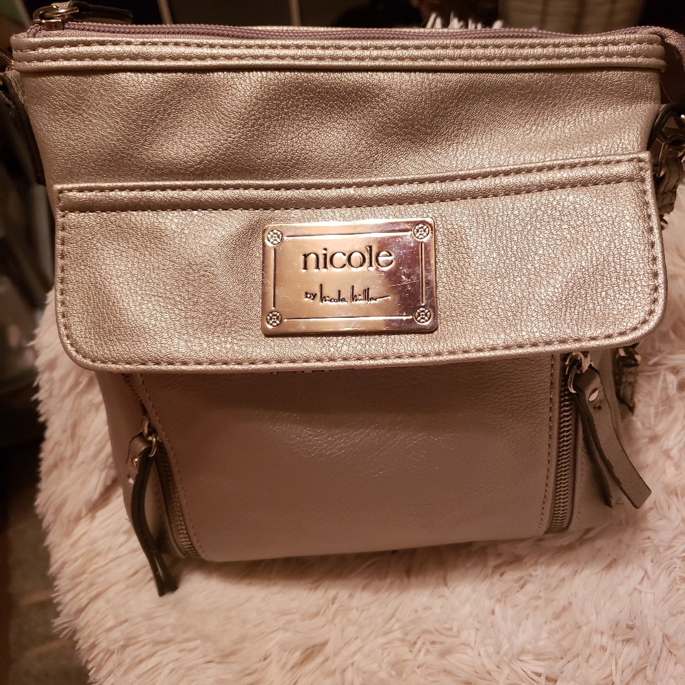 White crossover bag by (Calvin Klein)